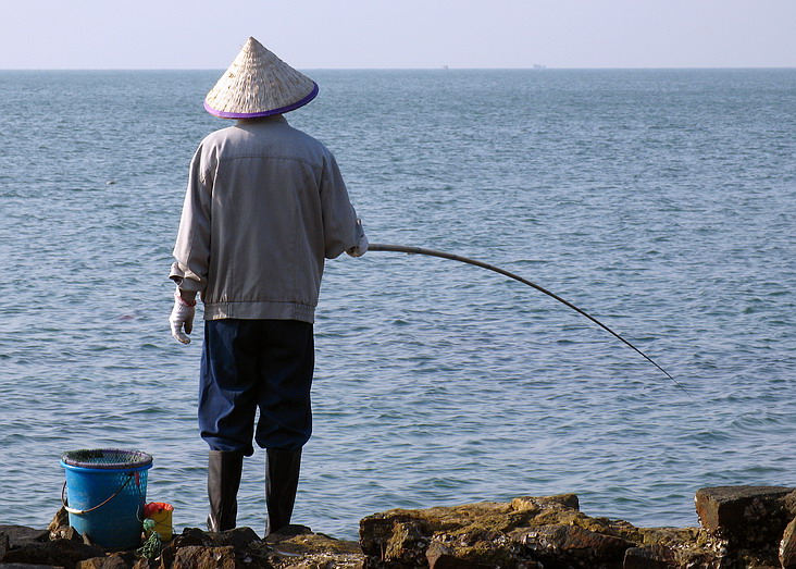 冬日海边的钓者 摄影 铱君